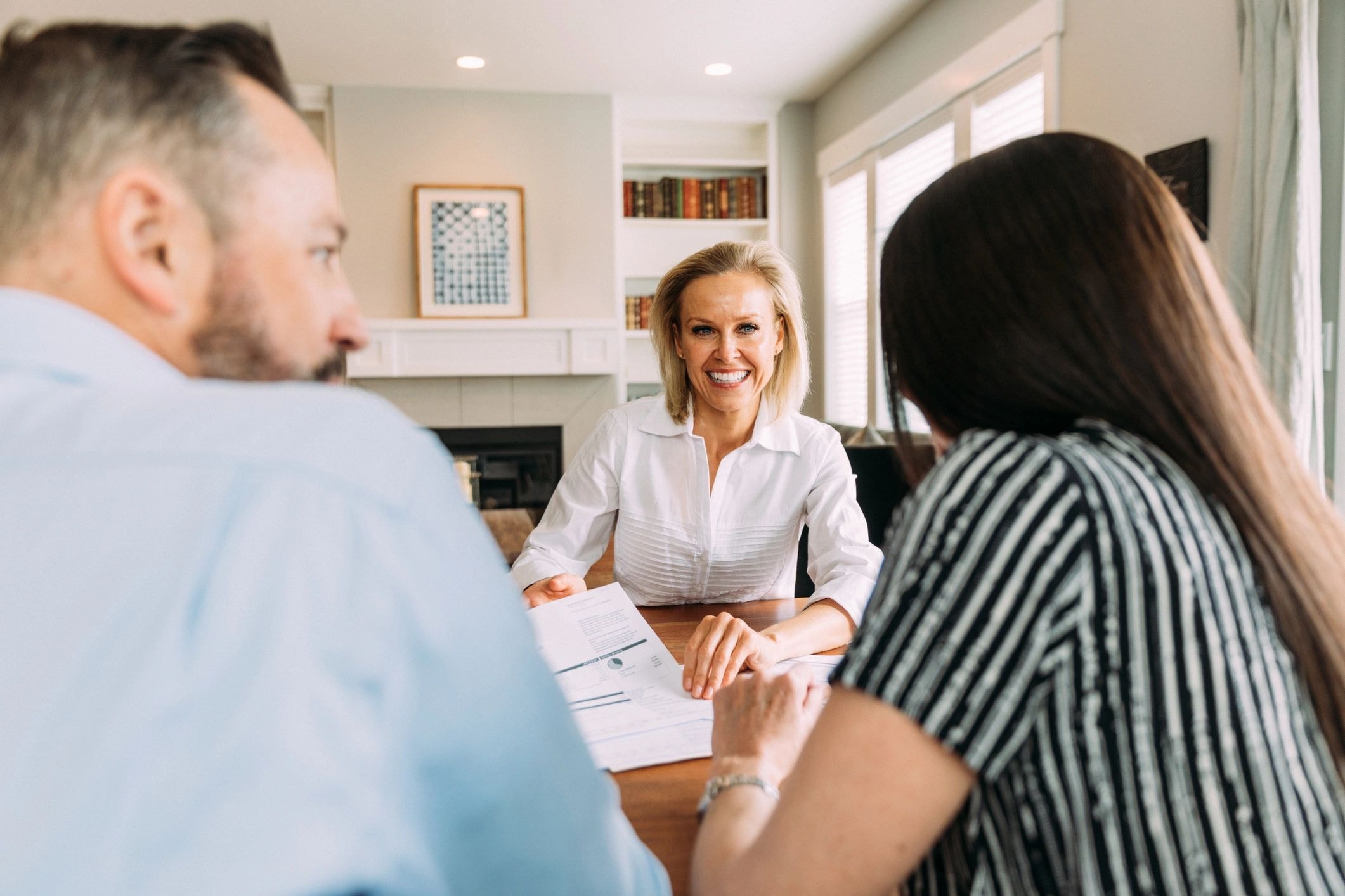 Vault Coach advisor meeting with a family in a warm home setting